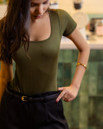green bodysuit